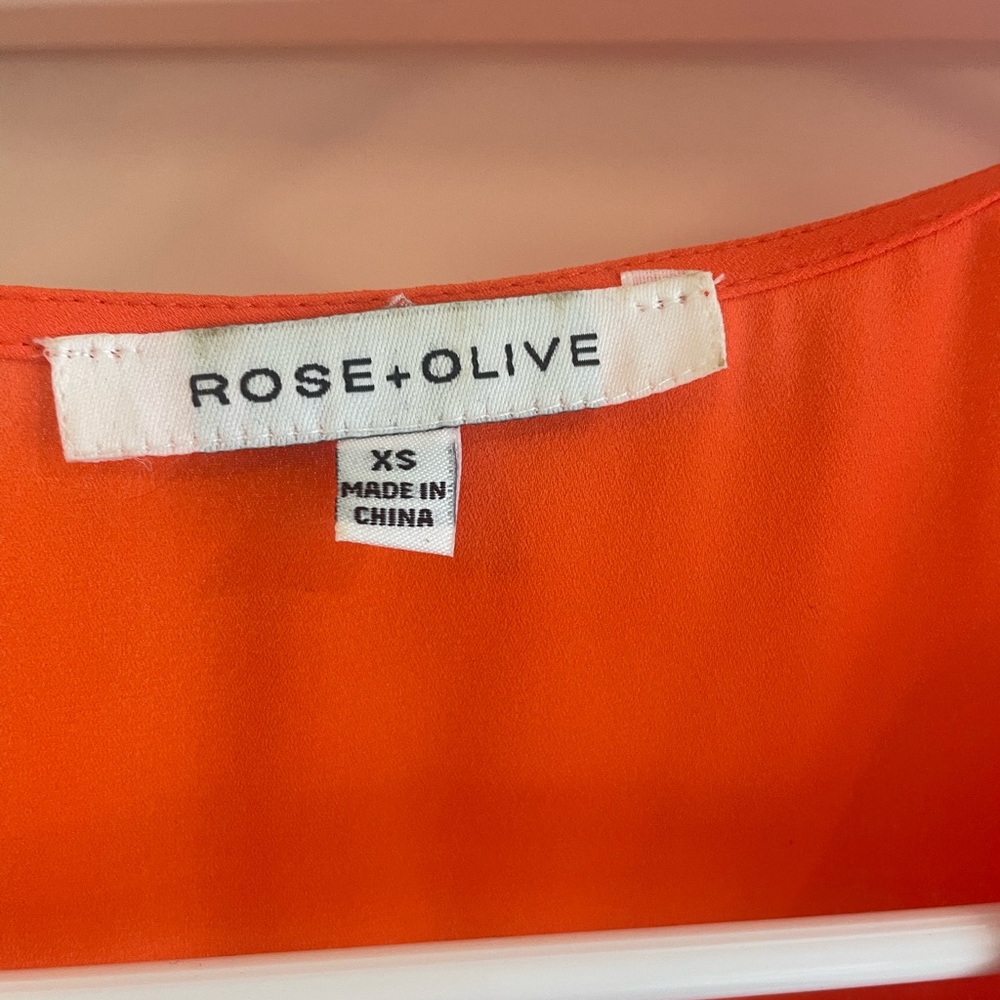 Orange tank top.  Rose + Oliver